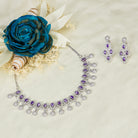 Violet zircon necklace adds a rich, sophisticated touch to festive looks.
