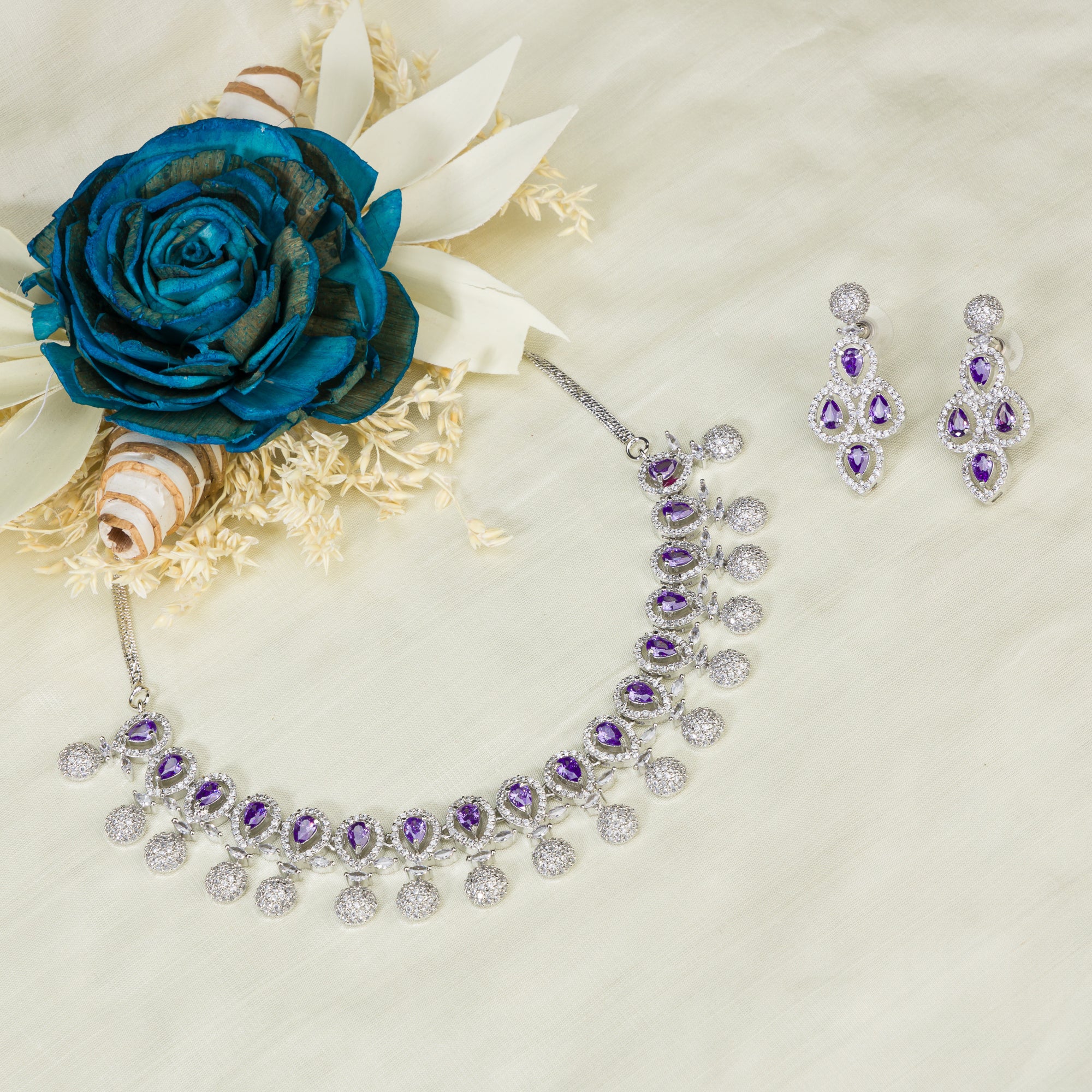 Violet zircon necklace adds a rich, sophisticated touch to festive looks.
