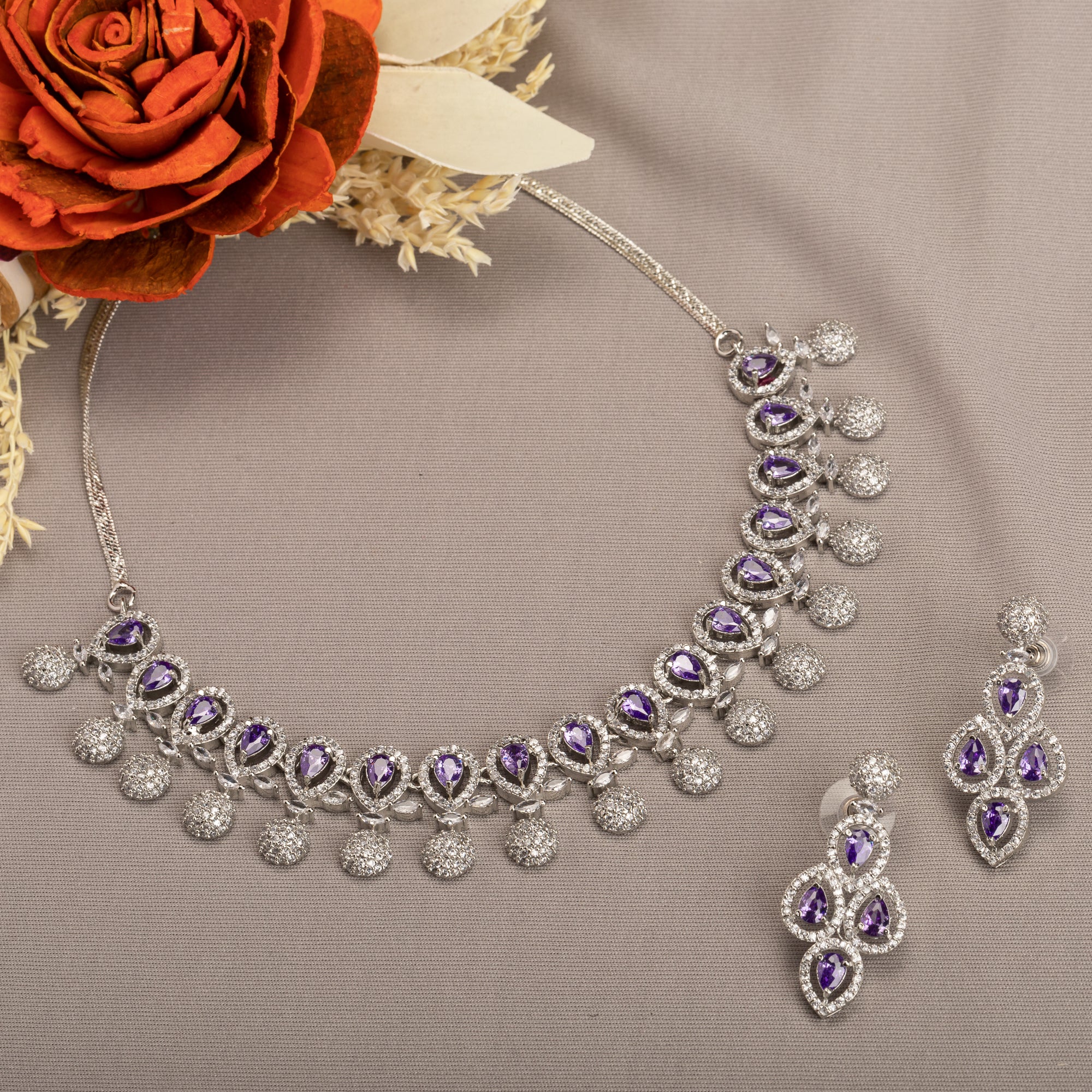 Violet zircon necklace adds a rich, sophisticated touch to festive looks.
