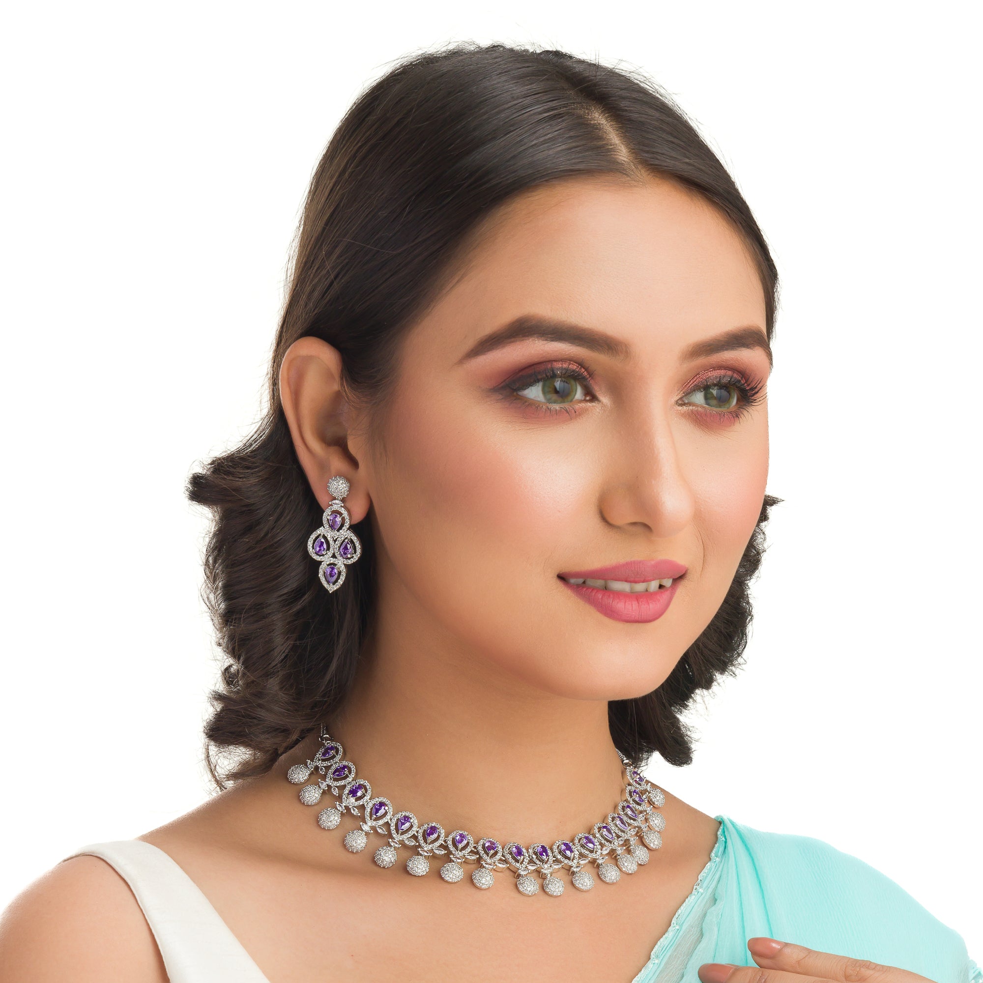 Violet zircon necklace adds a rich, sophisticated touch to festive looks.
