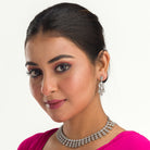 Elegant zircon necklace in silver polish offers rich, sophisticated charm.
