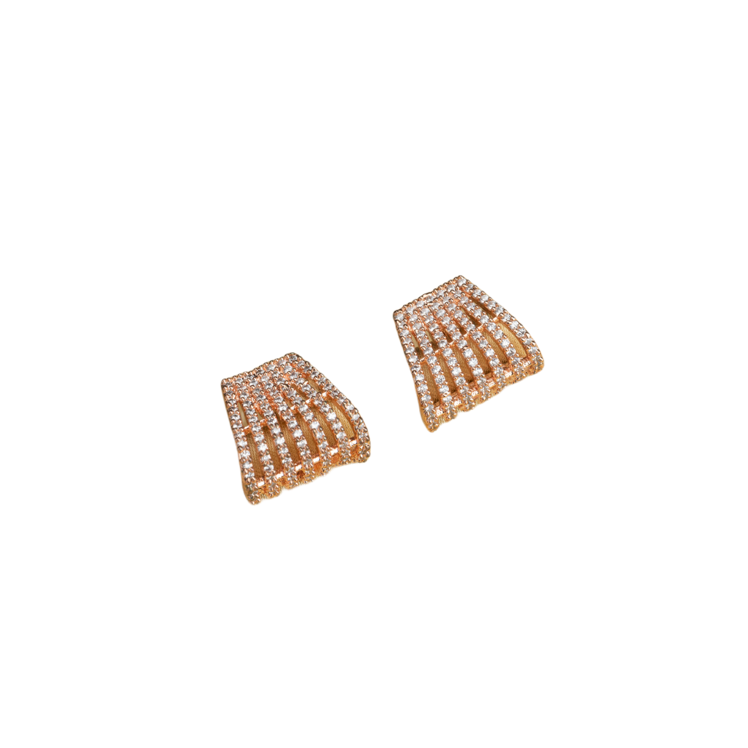 Trendy zircon studs with rose gold polish add a sleek and modern touch.
