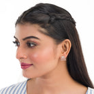 Trendy zircon studs with rose gold polish add a sleek and modern touch.
