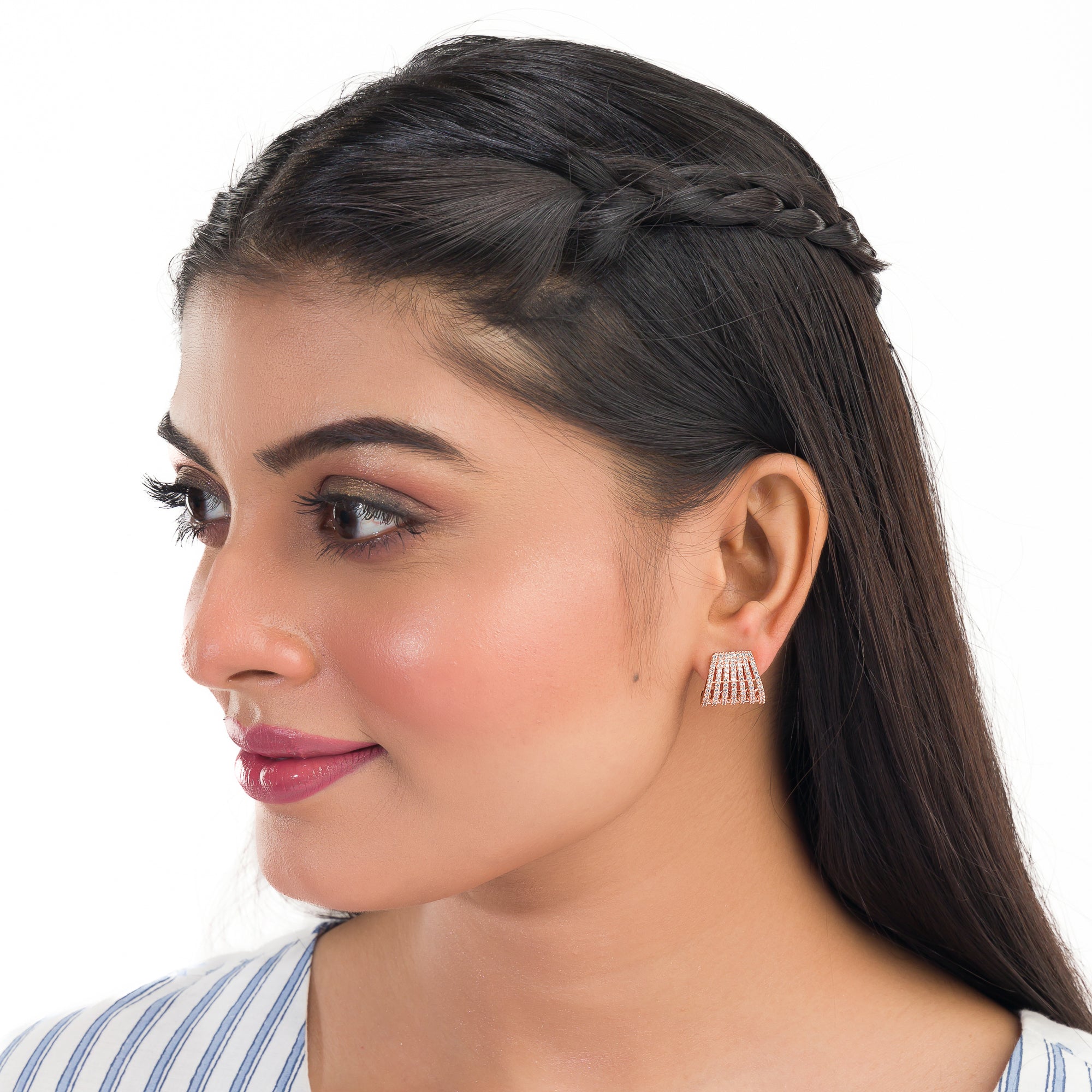 Trendy zircon studs with rose gold polish add a sleek and modern touch.
