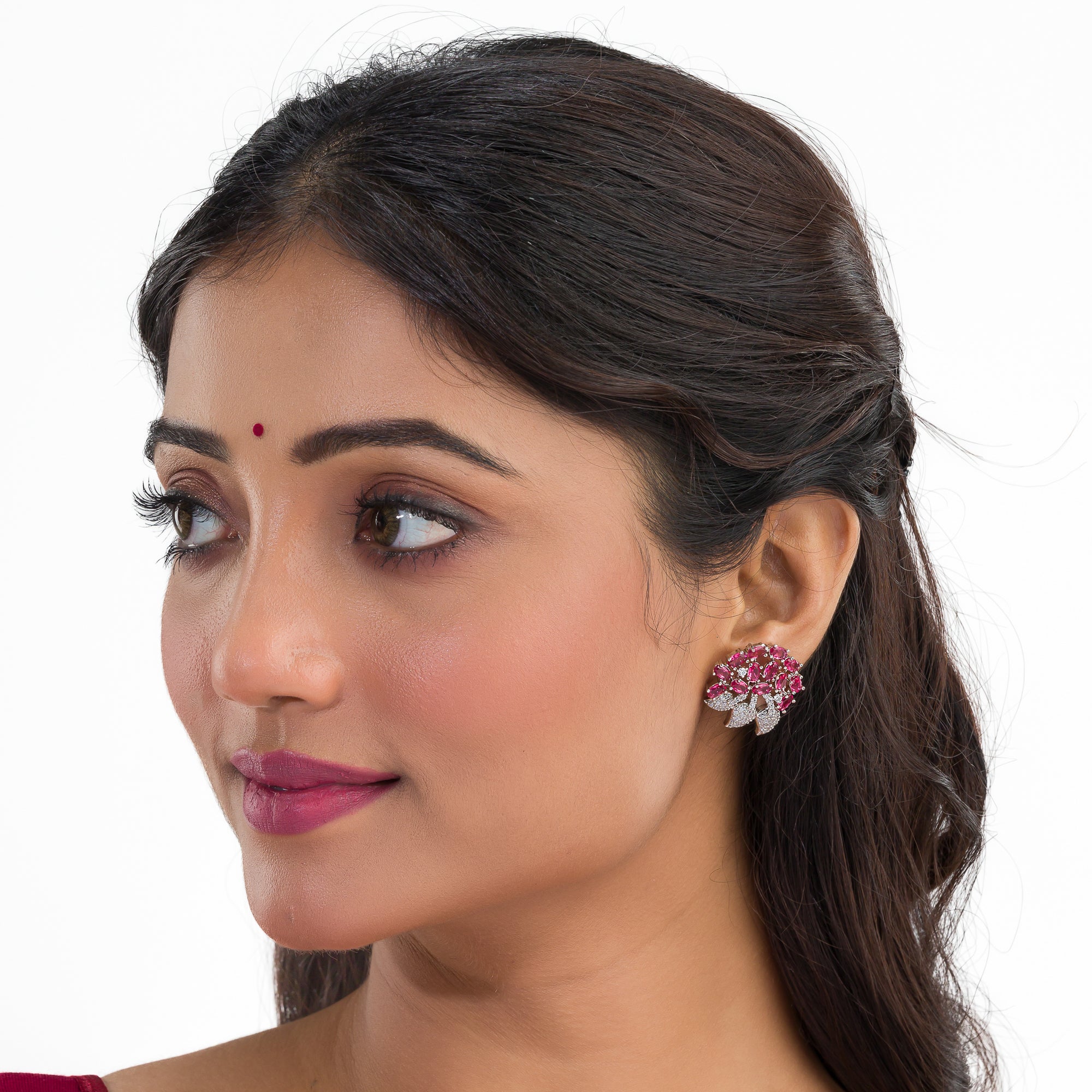 Pink zircon stud earrings exude bold elegance and sparkling charm.
