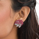 Pink zircon stud earrings exude bold elegance and sparkling charm.
