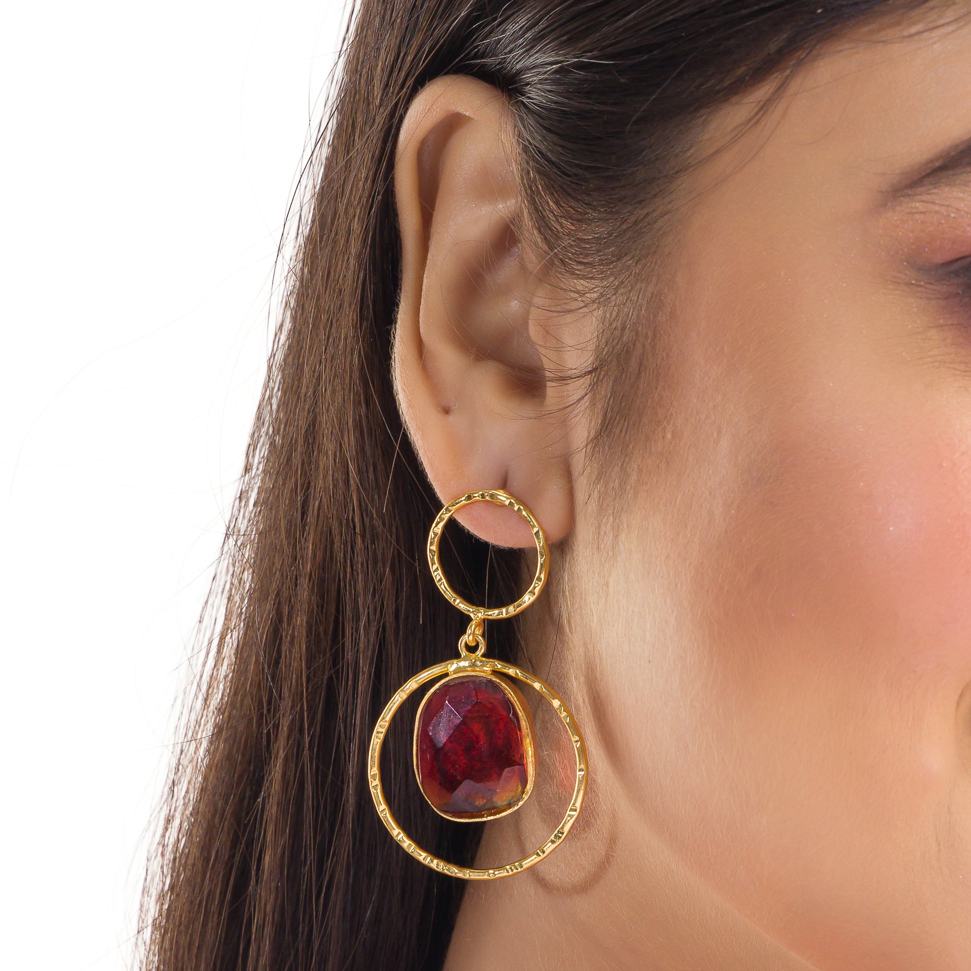 Bold gold-tone dangler earrings with red stone for a striking, luxurious look

