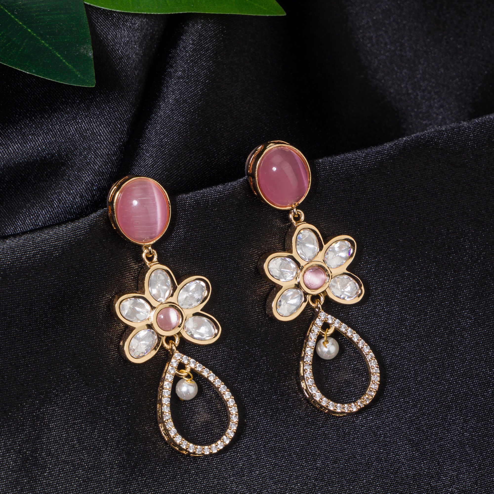 "Orchid gold-tone dangler earrings add a pop of color and refined shine for parties."
