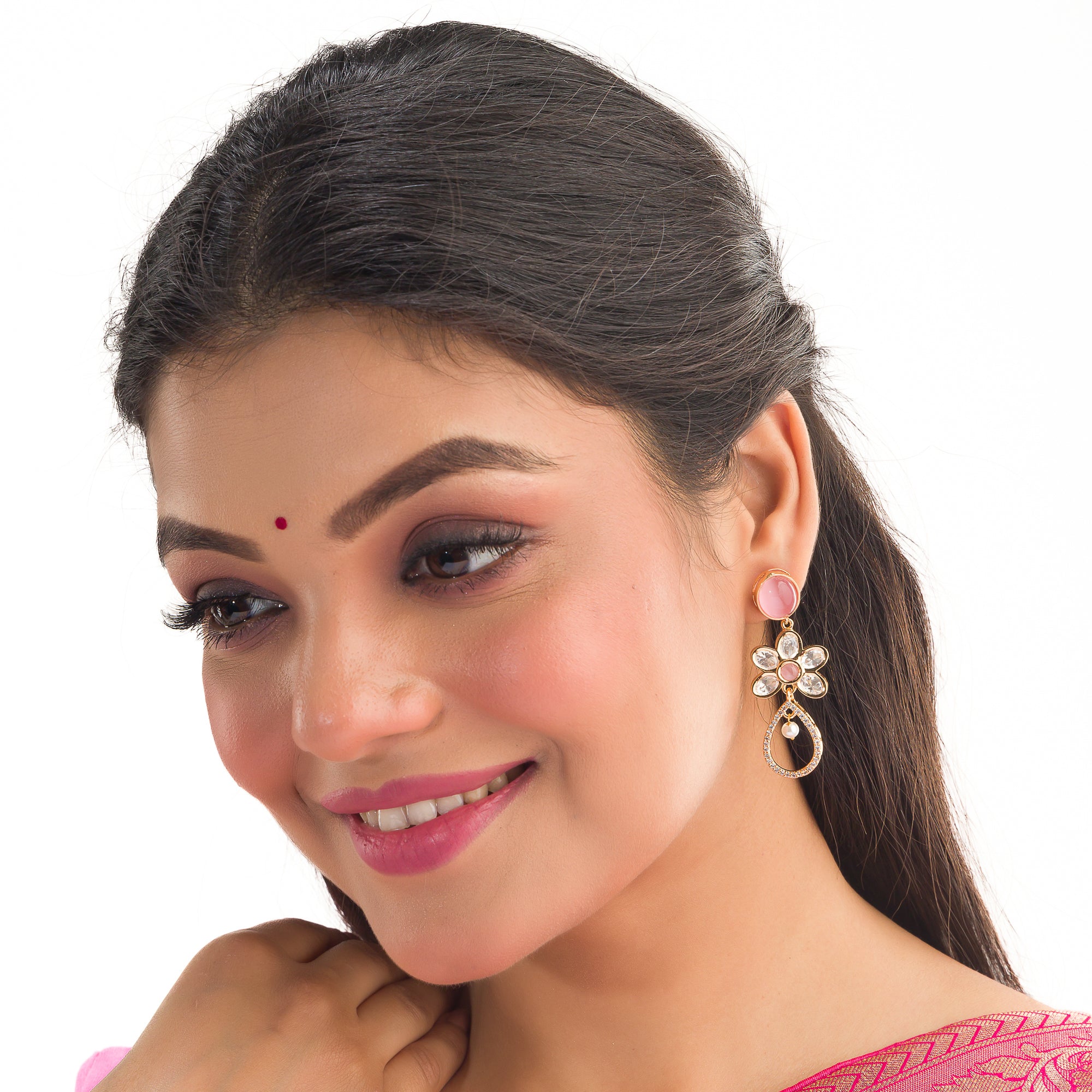 "Orchid gold-tone dangler earrings add a pop of color and refined shine for parties."
