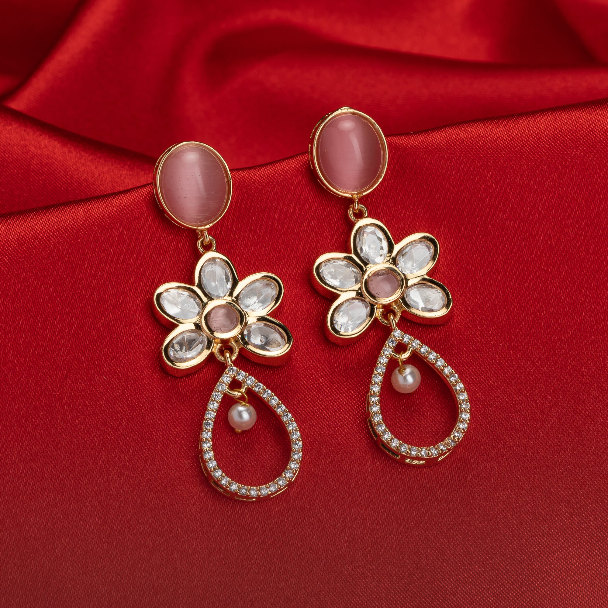 "Orchid gold-tone dangler earrings add a pop of color and refined shine for parties."
