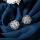 "Timeless zircon stud earrings with brilliant sparkle add versatile elegance to any outfit."
