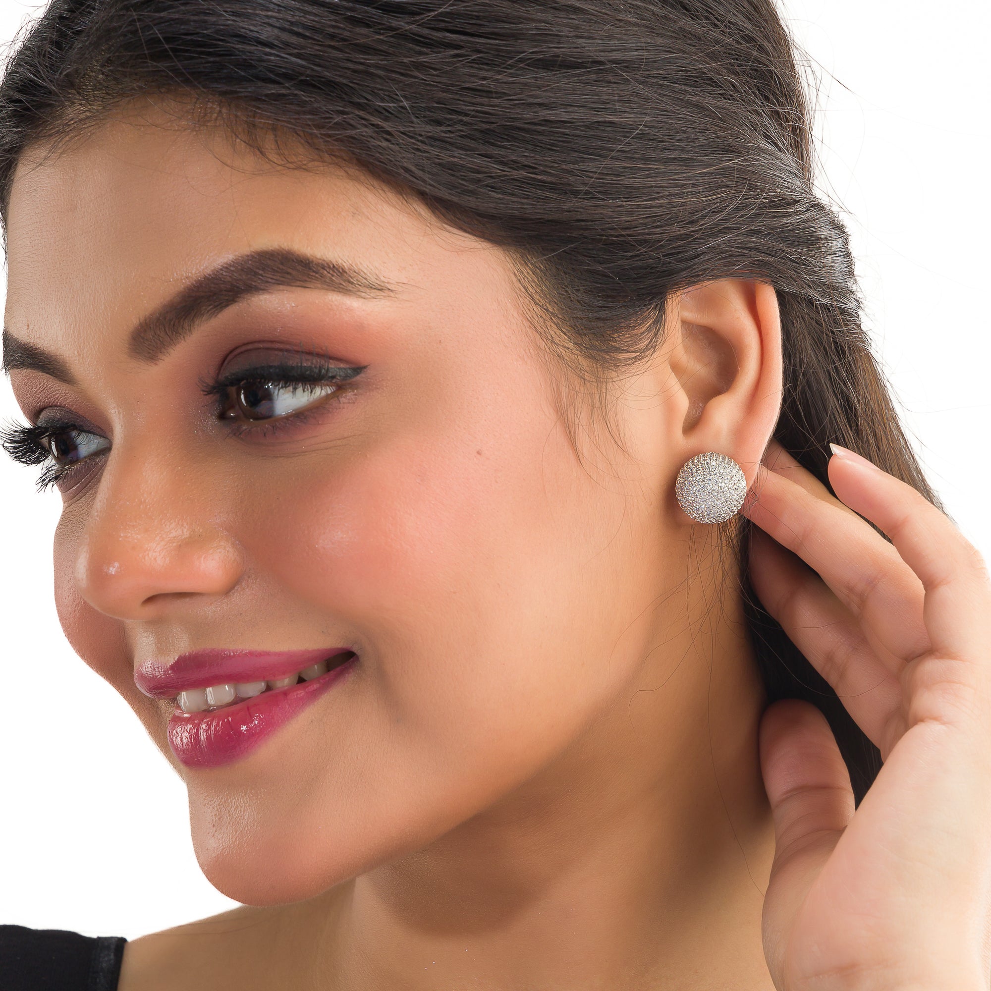 "Timeless zircon stud earrings with brilliant sparkle add versatile elegance to any outfit."
