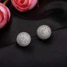 "Timeless zircon stud earrings with brilliant sparkle add versatile elegance to any outfit."
