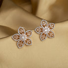 "Rose gold zircon earrings with sparkling brilliance for a sophisticated touch."
