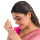 Red zircon floral design gold finger ring adds vibrant elegance with a sparkling touch.
