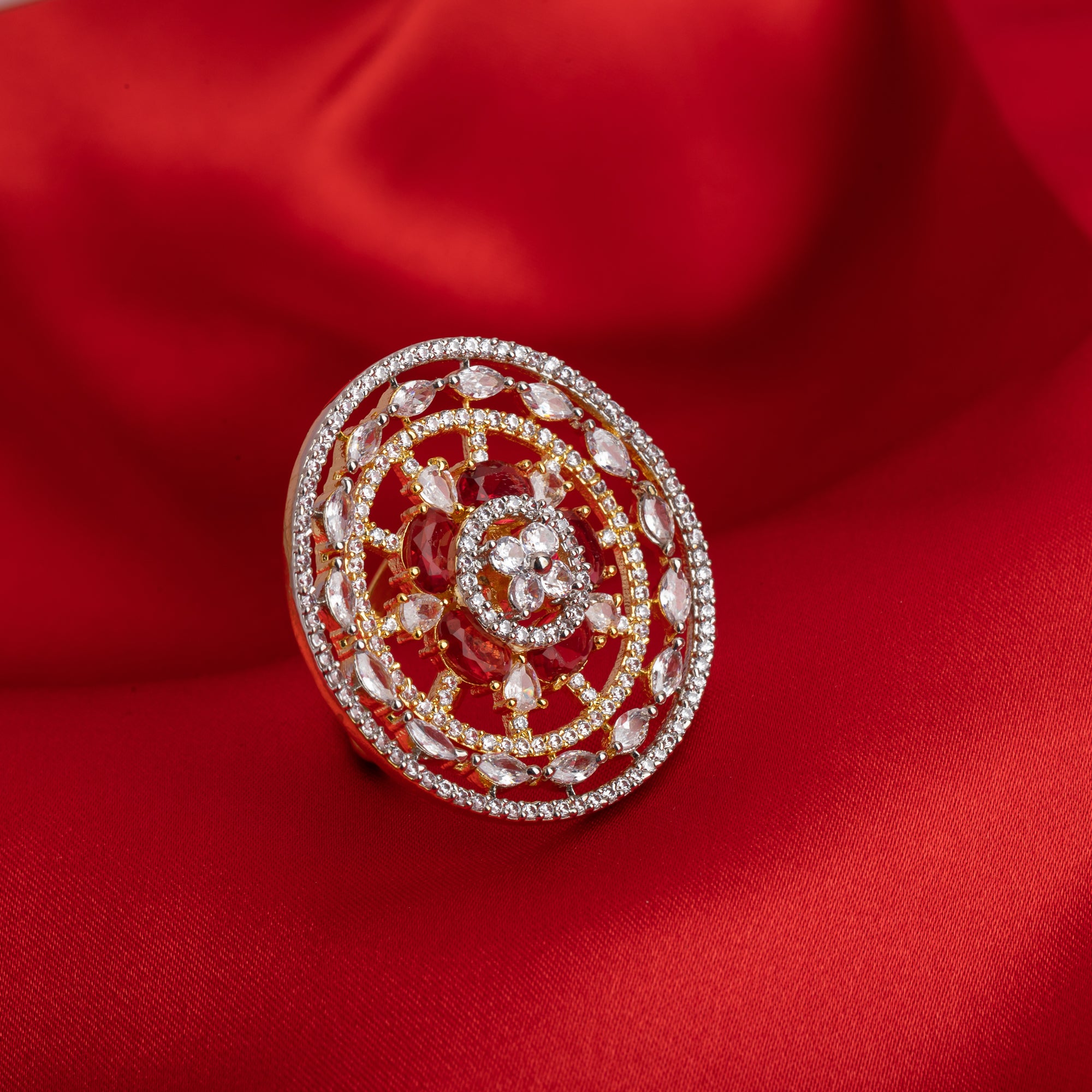 Red zircon floral design gold finger ring adds vibrant elegance with a sparkling touch.

