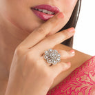 Silver floral zircon finger ring combines timeless beauty with sparkling brilliance.
