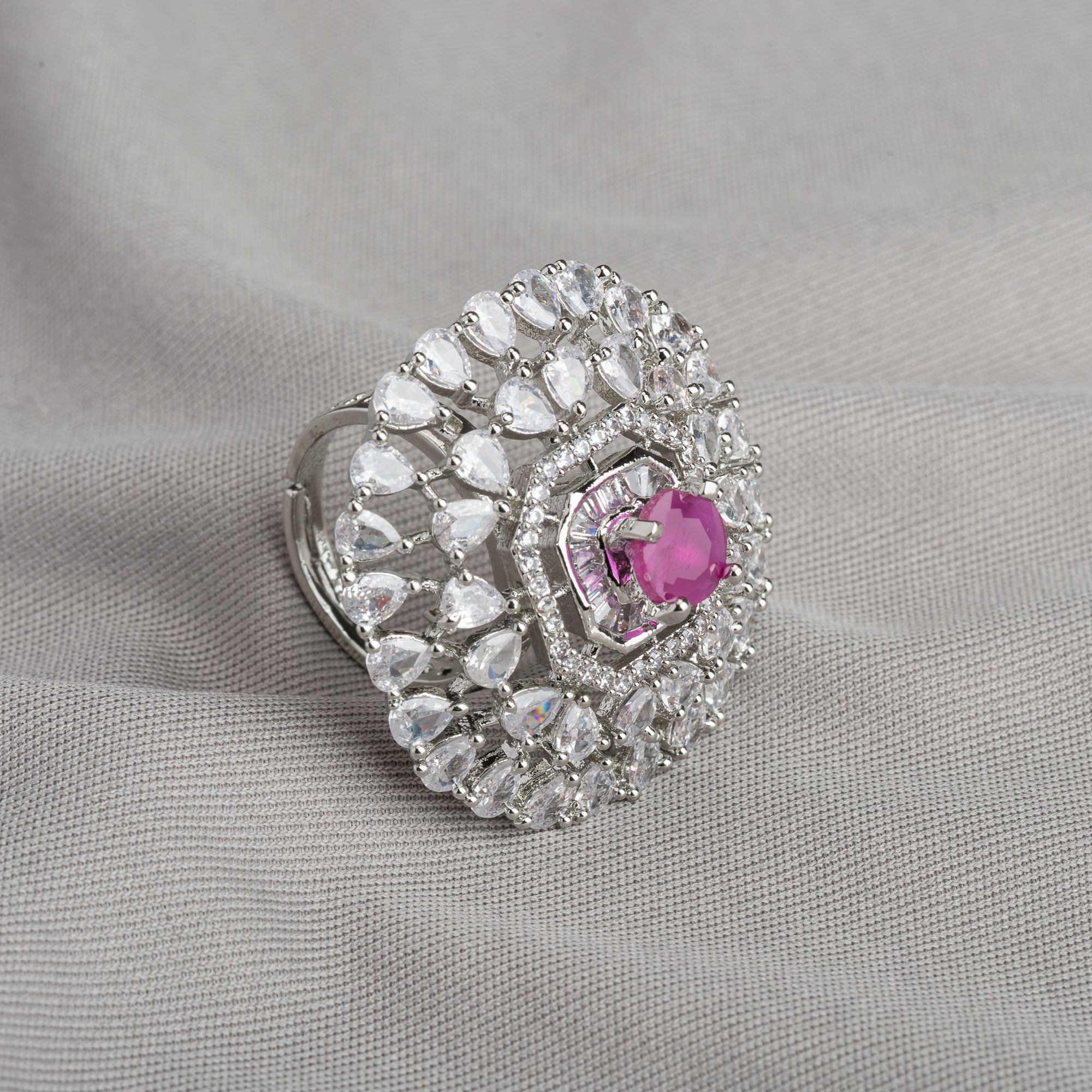 Zircon finger ring with pink stone adds a delicate and elegant touch, perfect for any occasion.
