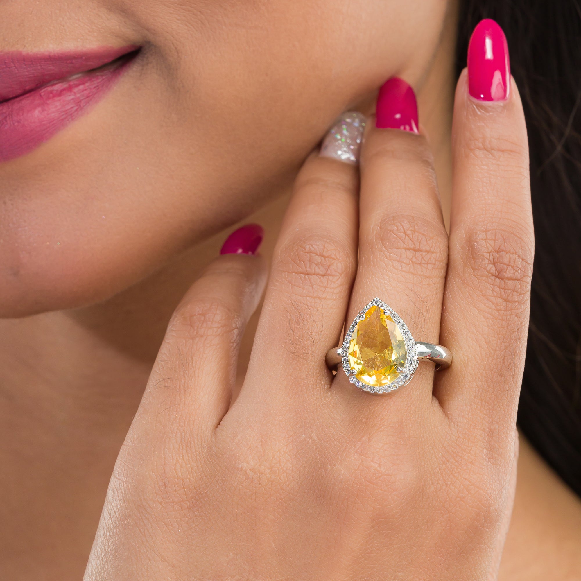 Zircon finger ring with yellow stone provides a bright and cheerful sparkle for casual wear.
