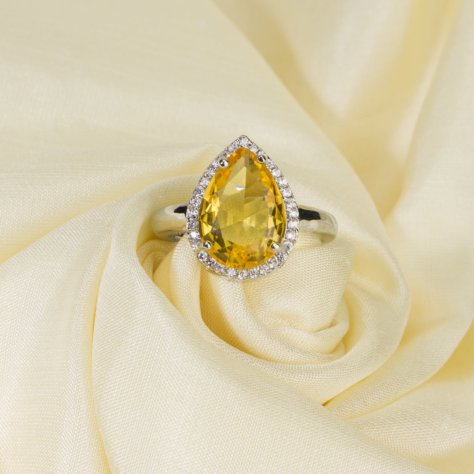 Zircon finger ring with yellow stone provides a bright and cheerful sparkle for casual wear.
