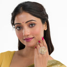 Gold-tone zircon finger ring combines dazzling sparkle with timeless elegance.
