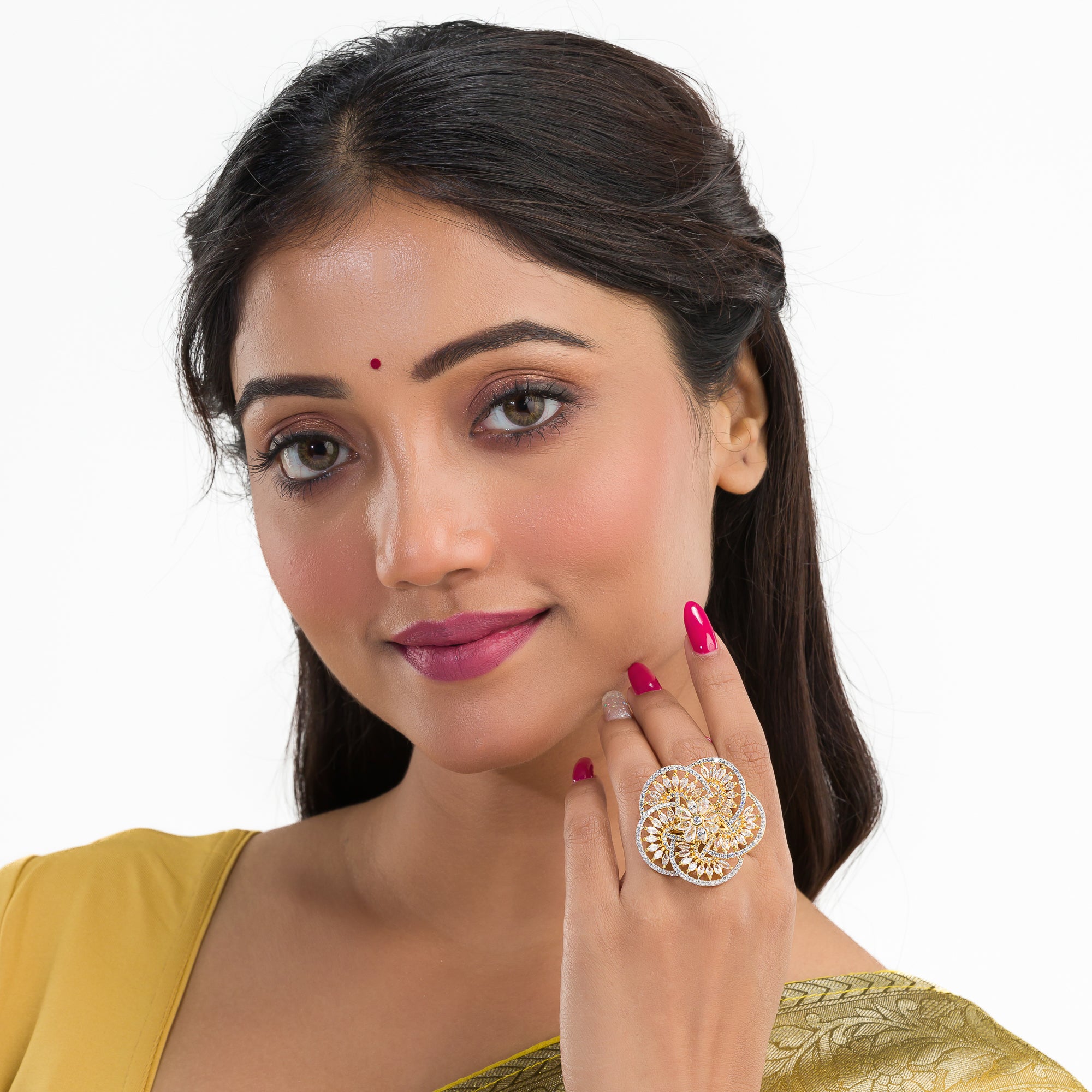 Gold-tone zircon finger ring combines dazzling sparkle with timeless elegance.
