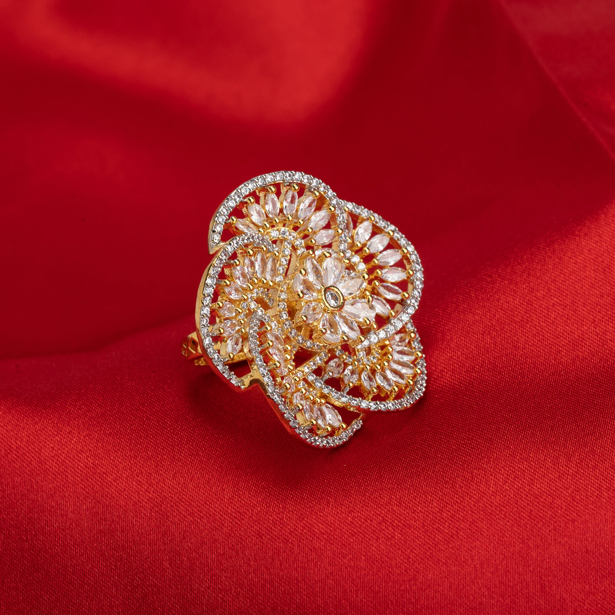 Gold-tone zircon finger ring combines dazzling sparkle with timeless elegance.

