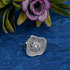 Silver zircon finger ring offers a dazzling design for a glamorous party-ready look.

