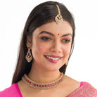 Red zircon bridal necklace set features intricate designs, perfect for a regal wedding look.
