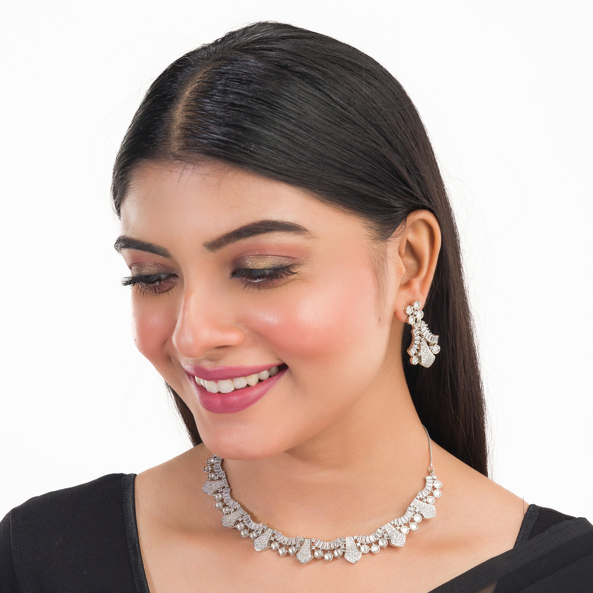White zircon stone-studded short necklace set with matching earrings for timeless elegance.

