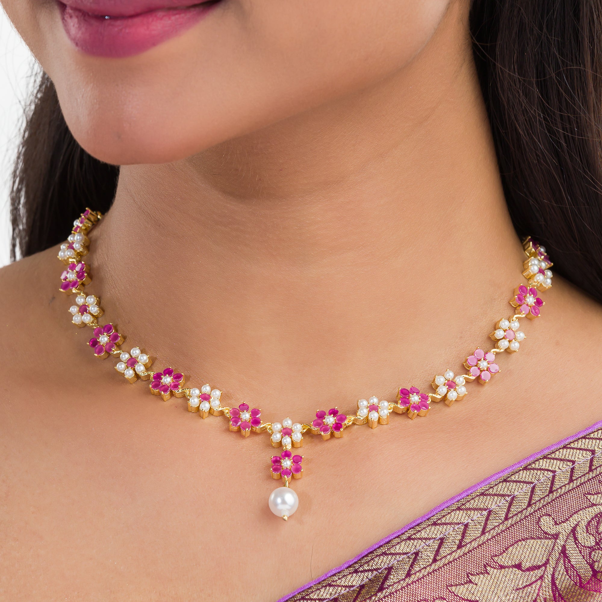 Pink pearl floral necklace set with matching earrings for timeless elegance and beauty.
