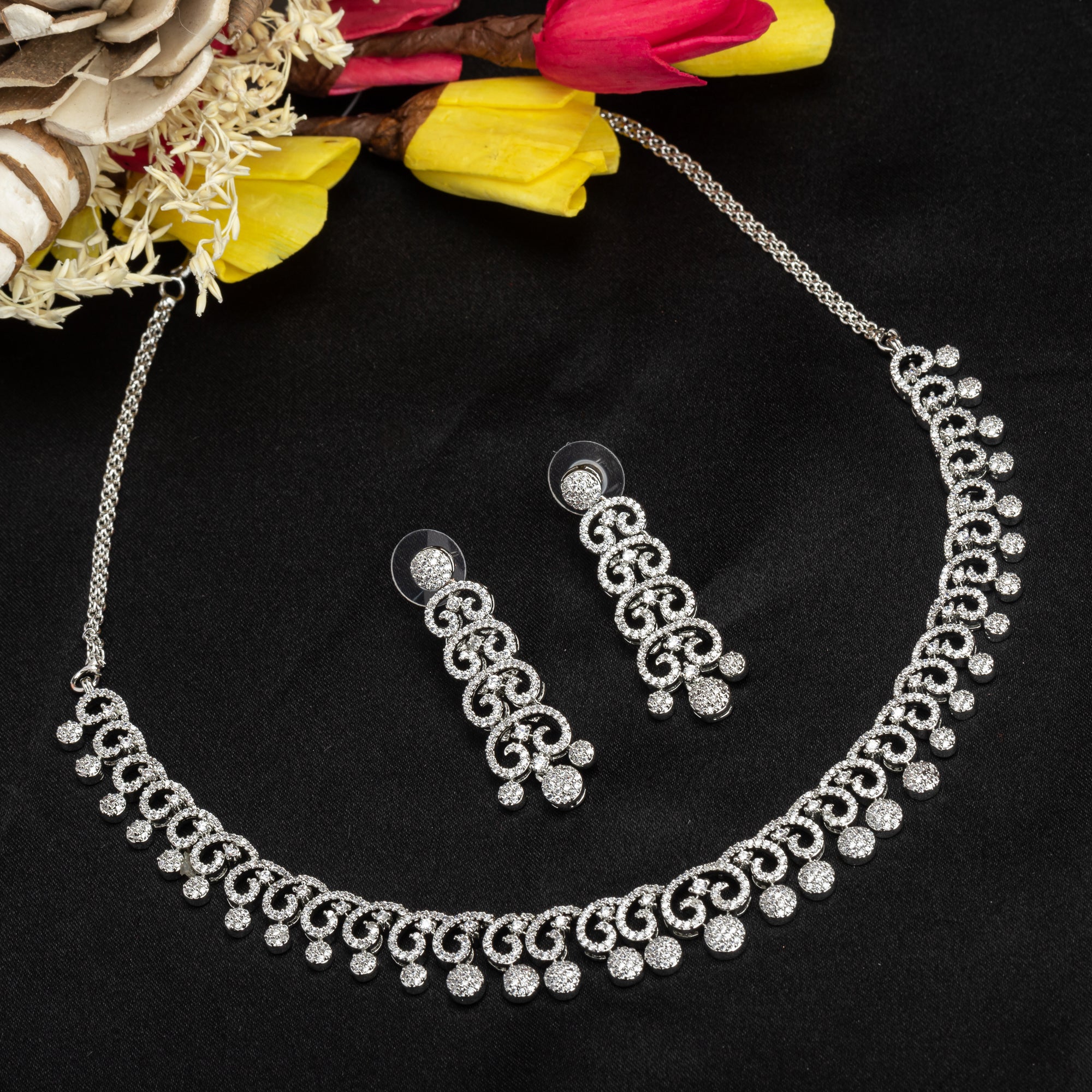 White zircon necklace set with matching earrings for timeless elegance and sophistication.
