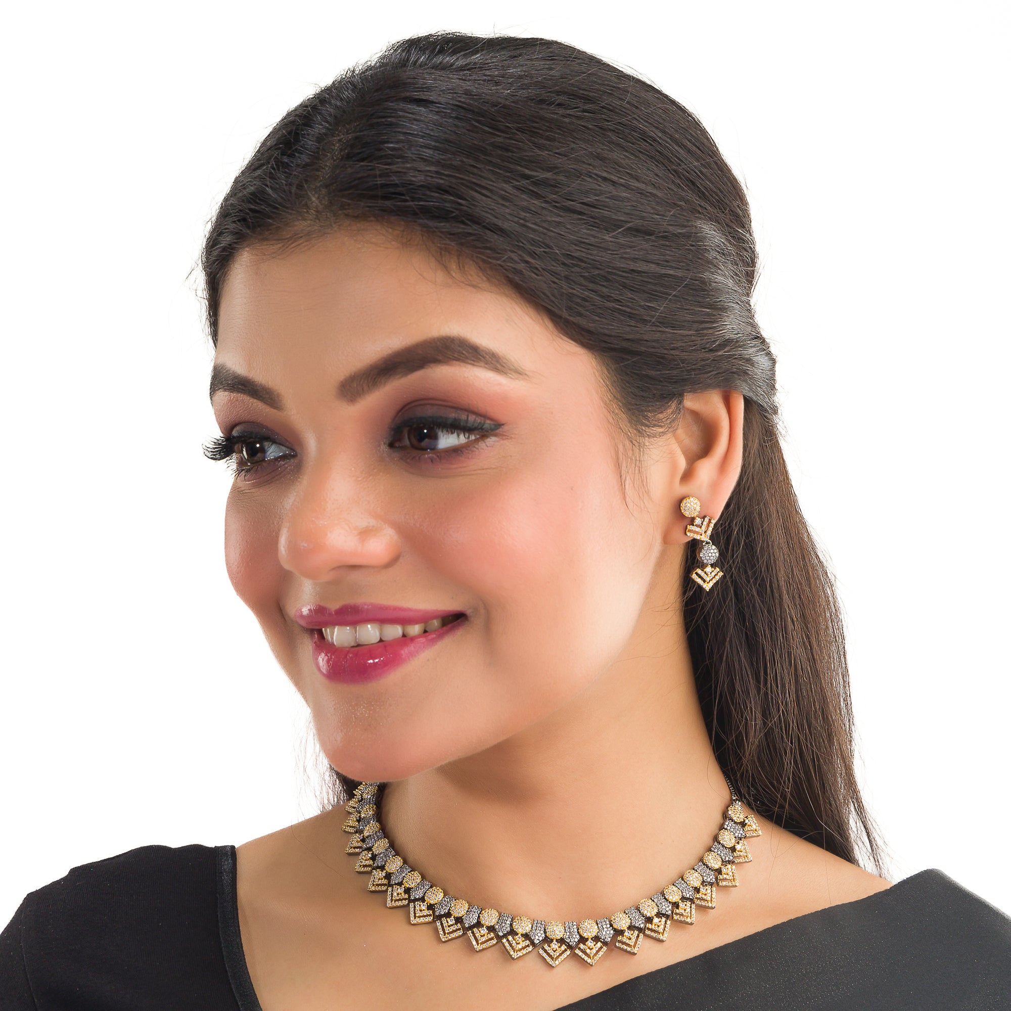 Black polished necklace set with golden and white zircon stones for an elegant and striking contrast.
