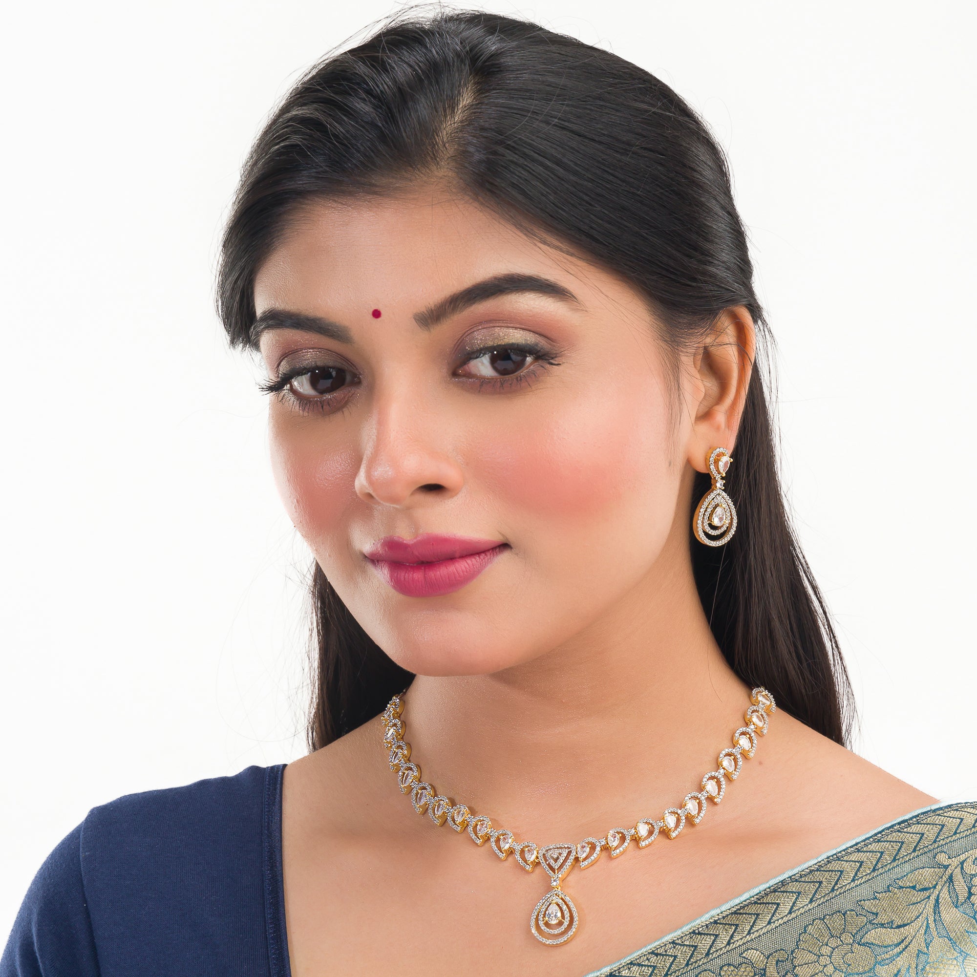 Golden polish zircon necklace set with matching earrings, blending luxury and elegance.
