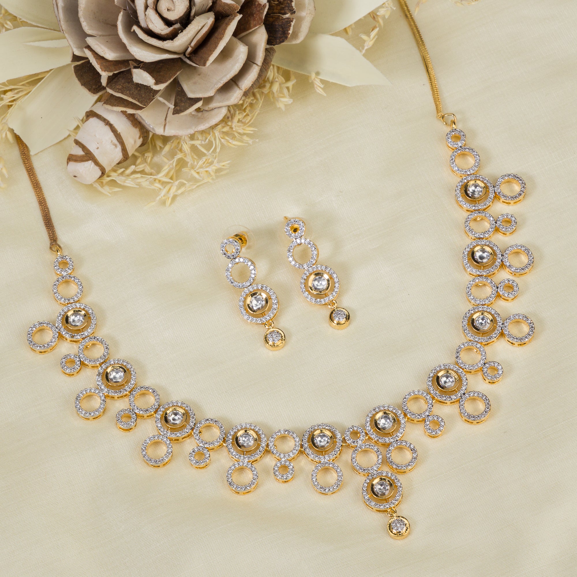 Golden polish zircon necklace set with matching earrings, offering luxury and elegance.
