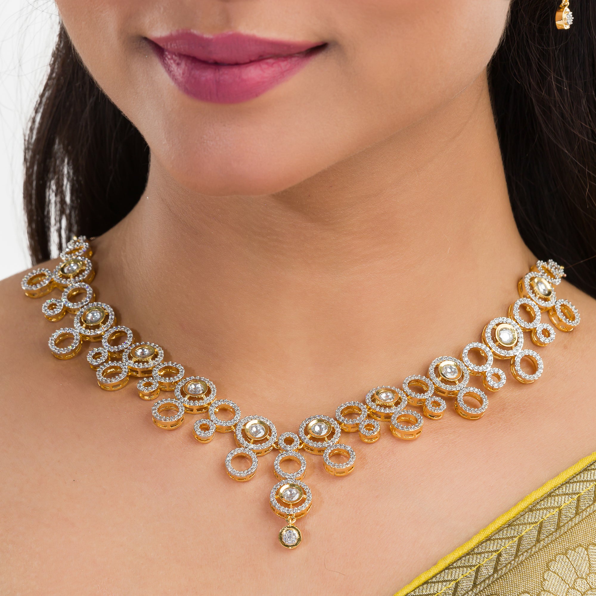 Golden polish zircon necklace set with matching earrings, offering luxury and elegance.
