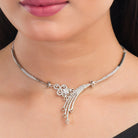 Elegant zircon-studded silver necklace set for a refined and sparkling party look.
