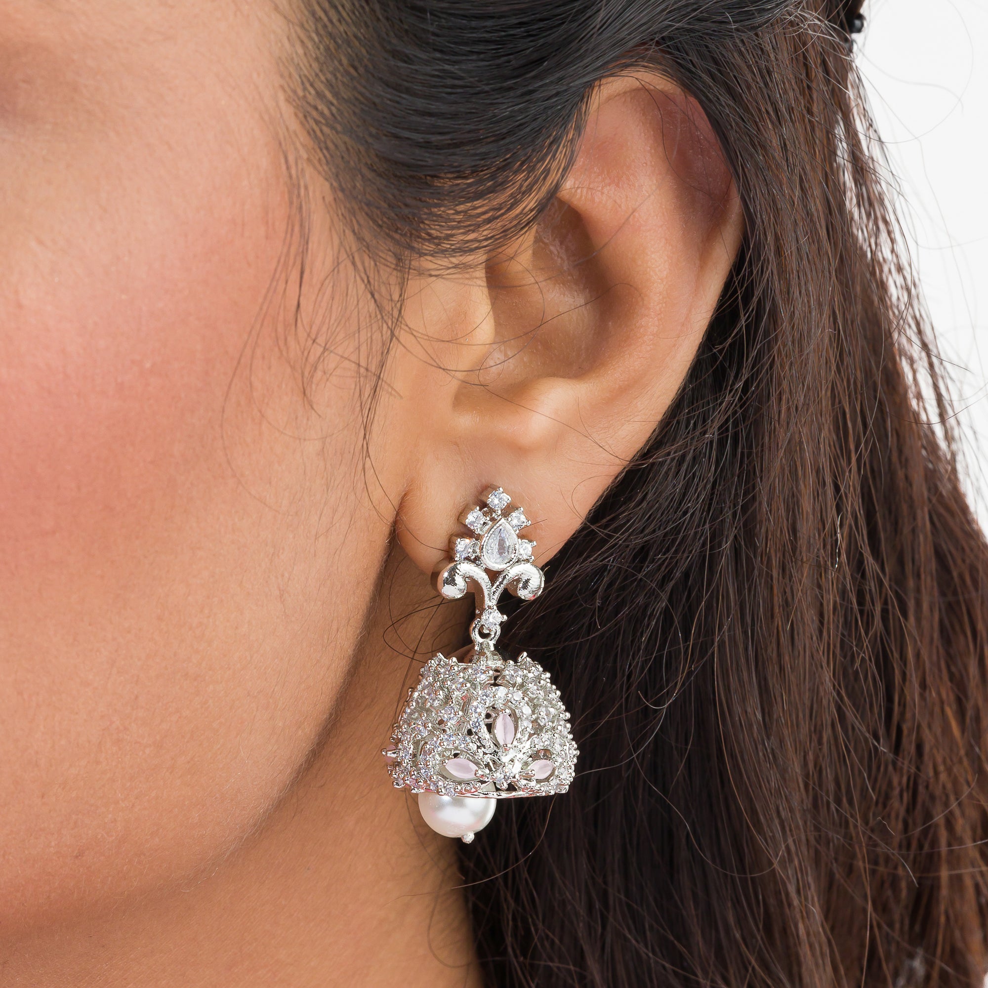 Orchid-colored zircon necklace set with matching jhumkas for an elegant party look.
