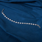 Silver zircon-studded chain bracelet, perfect for adding shimmer to your party wear.
