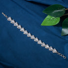 Silver zircon-studded chain bracelet adds sparkle and elegance to your party outfit.

