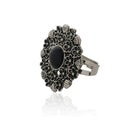 Vintage oxidized silver finger ring with intricate patterns and an antique finish.
