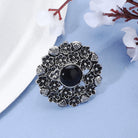 Vintage oxidized silver finger ring with intricate patterns and an antique finish.
