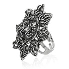Vintage-inspired oxidized floral design finger ring with intricate patterns and antique finish.
