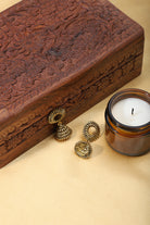 "Elegant oxidized jhumkas with golden detailing, merging traditional charm with a modern twist.
