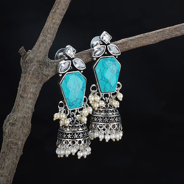 "Elegant oxidized silver jhumkas with intricate detailing, blending traditional and modern style."
