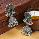 "Exquisite oxidized jhumkas with a beautifully crafted peacock feather design, perfect for festive occasions."
