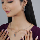 Elegant 925 sterling silver pendant set with delicate leaf design for casual natural charm.

