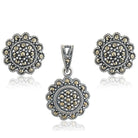 Graceful 925 silver pendant and earrings with intricate floral design for timeless elegance.
