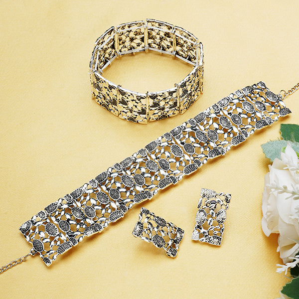  Elegant oxidized choker set with matching earrings and bracelet, ideal for a stylish festive look.
