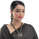 Intricate oxidized necklace set with a beautiful peacock design for a festive look.
